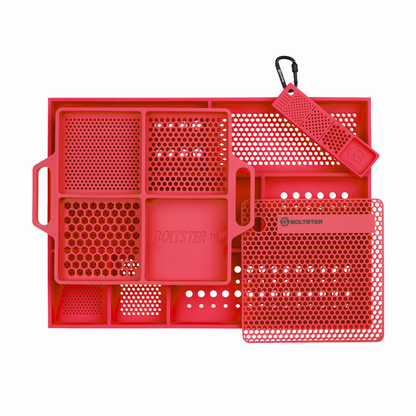 Red plastic tray with compartments and a carabiner on a white background